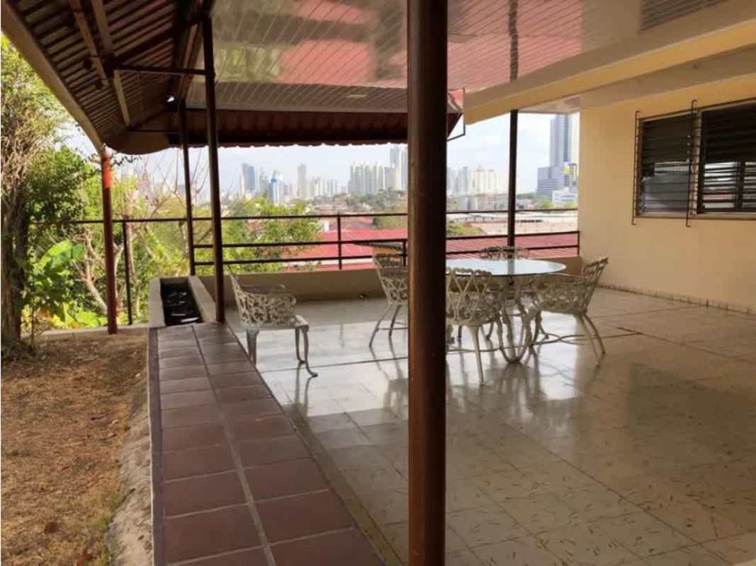 Backyard garden with covered patio and tiled floor Betania Panama house for sale