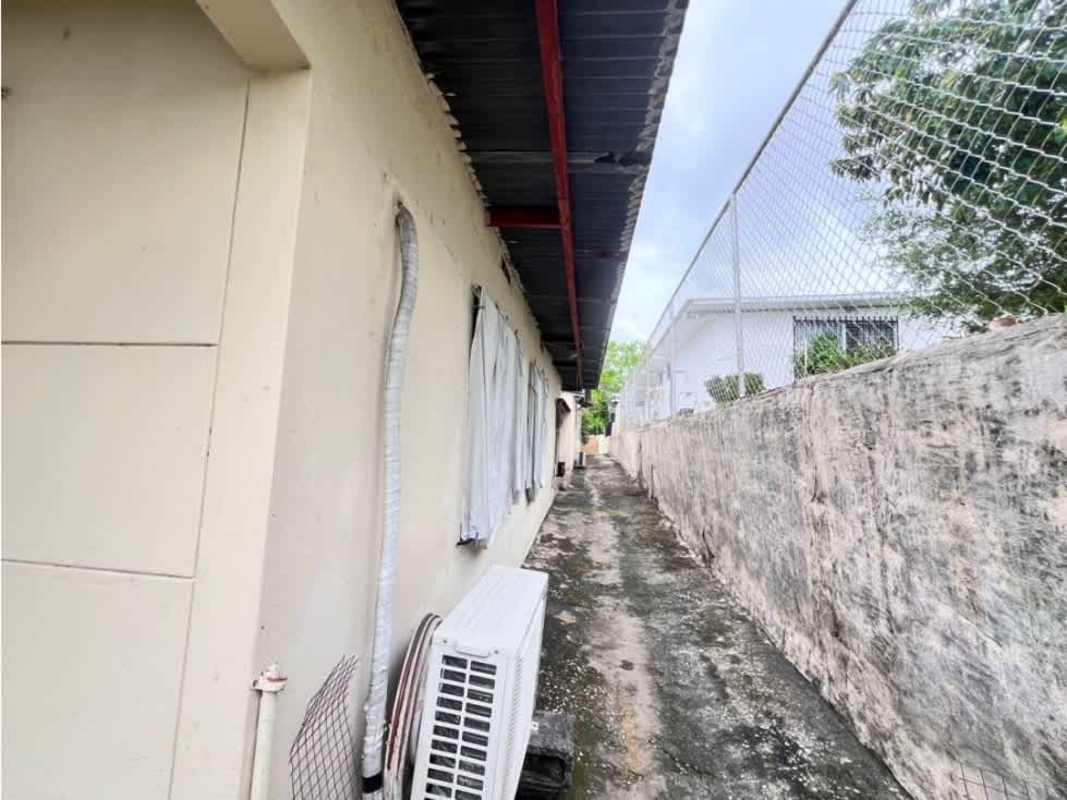 Landscaped yard with palms, sculpture, secured wall and garden area, Betania Panama City