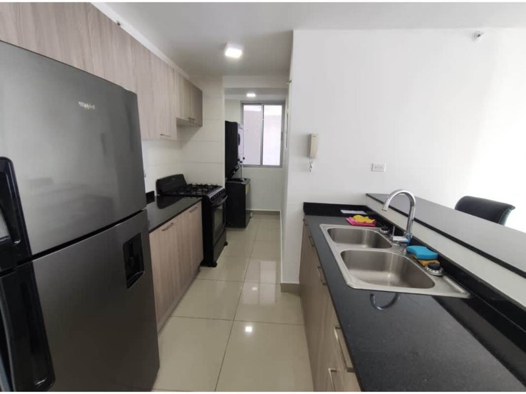 Open kitchen granite countertops black cabinets stainless steel appliances apartment for sale Coral Tower Carrasquilla Panama