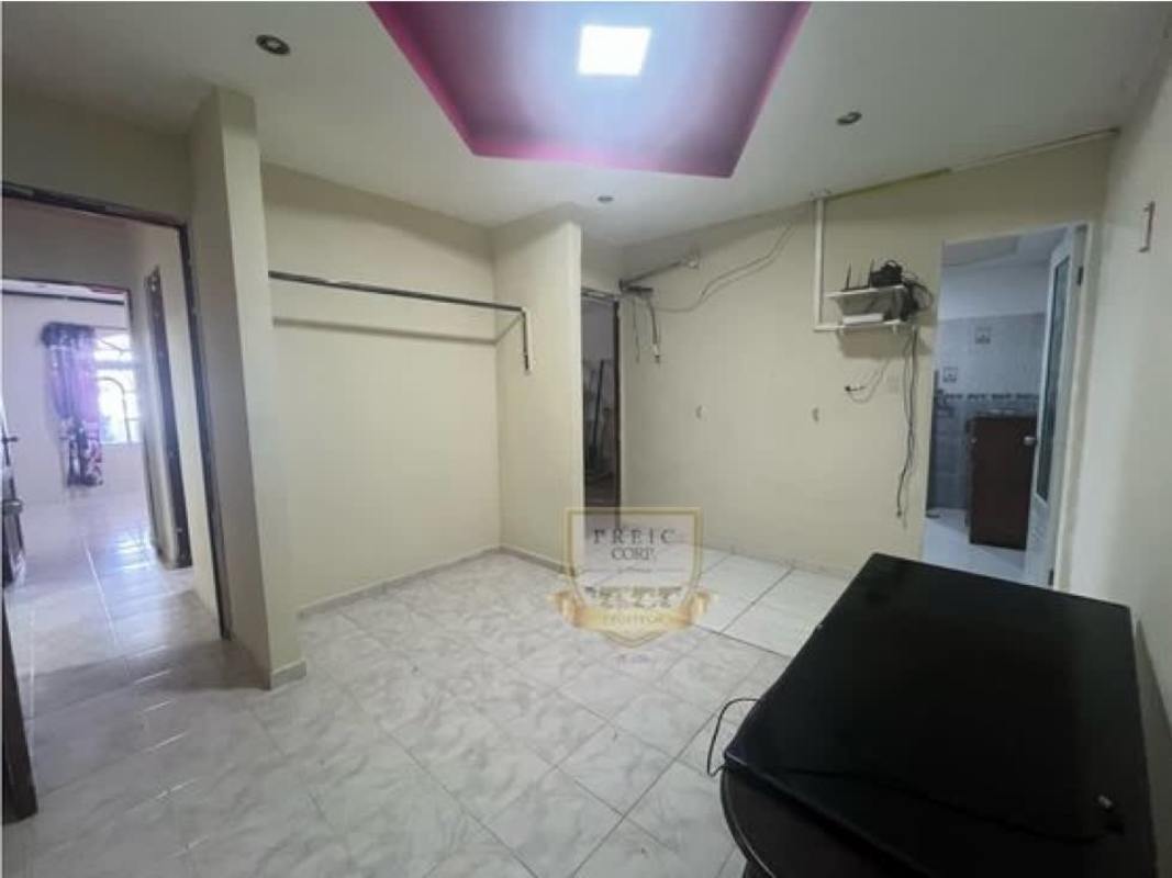 Living room with ceramic tile, pink accent ceiling and bright lighting in affordable house Tocumen Panama