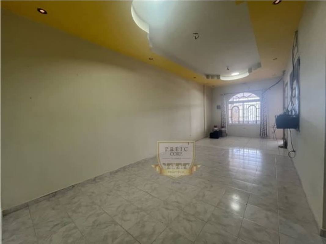 Living room with arched window, tile floor, recessed lighting in Tocumen affordable house