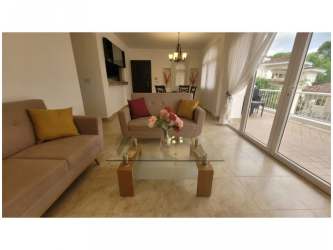 Covered outdoor terrace with garden view in townhouse for rent at Tucan Country Club Panama