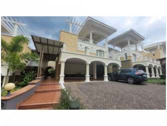 Contemporary kitchen with granite countertops, modern cabinetry, stainless appliances in Tucan Country Club townhouse Panama