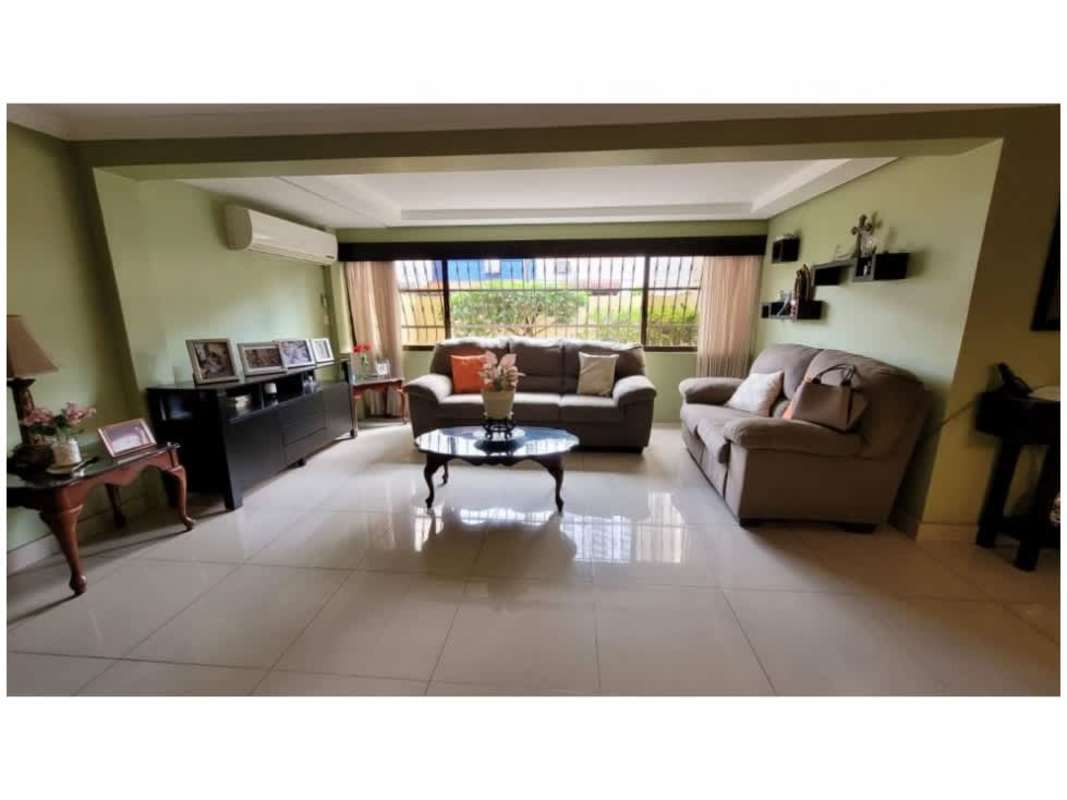 Kitchen with cabinetry, tile counters and breakfast area in house for sale Altos del Golf