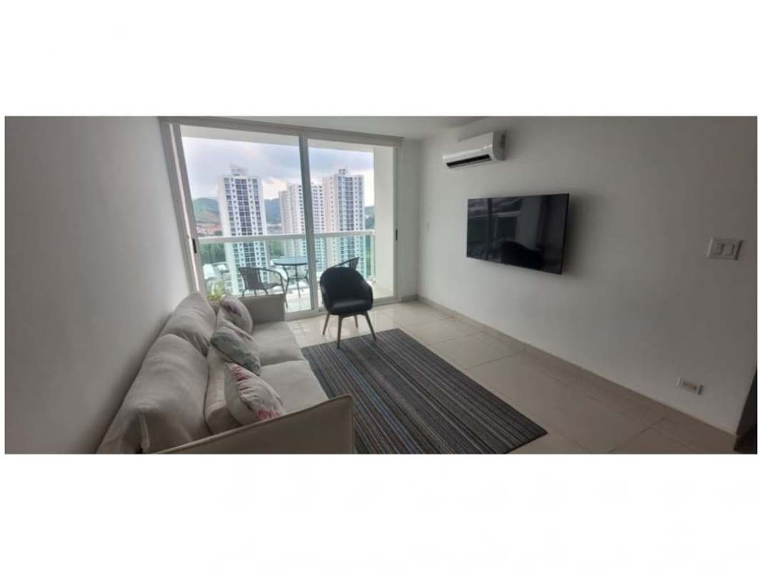 Balcony with glass railing overlooking city skyline and green areas in Condado del Rey