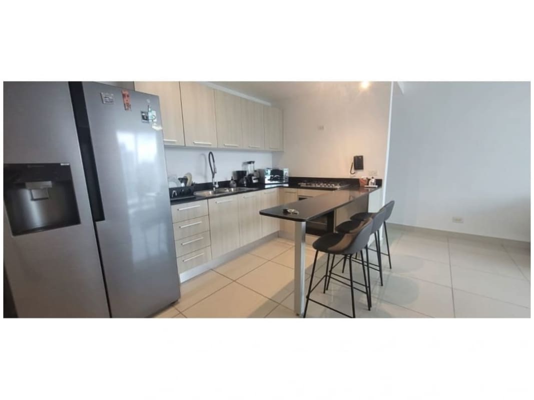 Double height elegant lobby entrance with seating at PH Mi Condado Condado del Rey