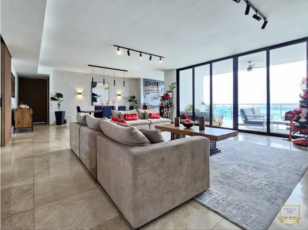 Elegant living and dining room with marble floors, terrace access, ocean views at PH Aqualina Punta Pacífica Panama