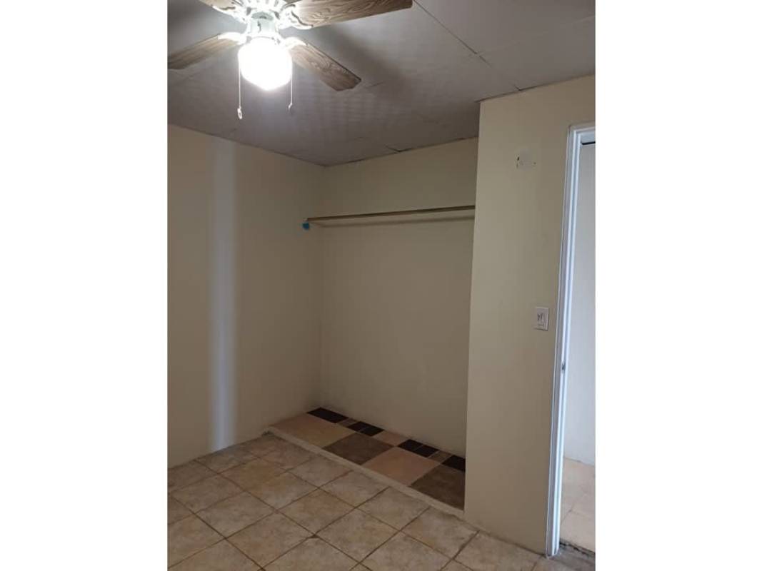 Bedroom with ceiling fan and closet tiled floor Don Bosco house for sale Panama City