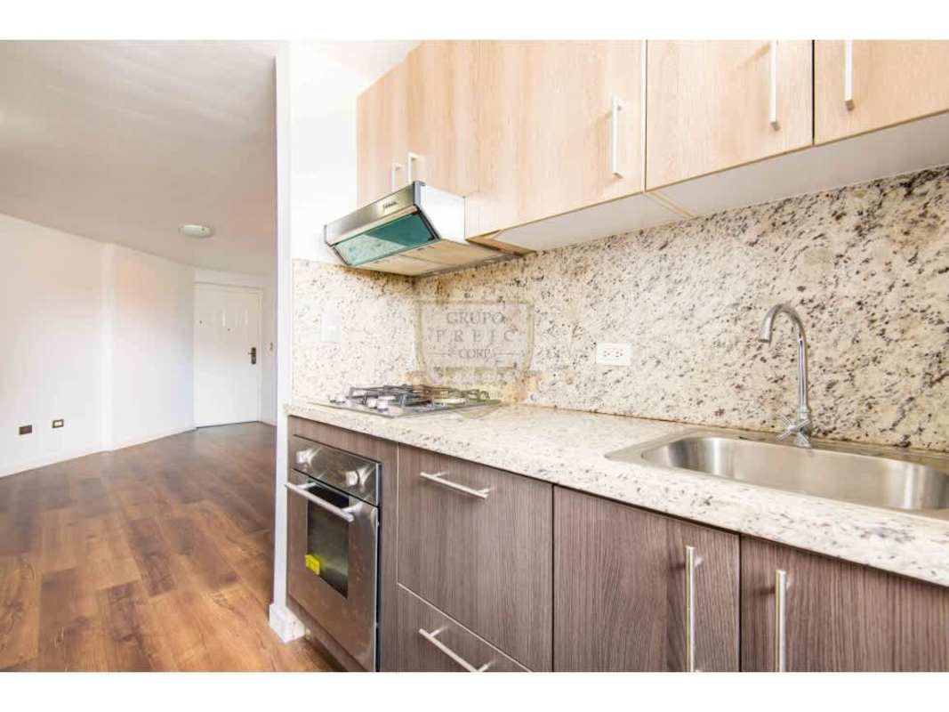 Family friendly playground with slides and swings amid apartment buildings in Llano Bonito Panama City