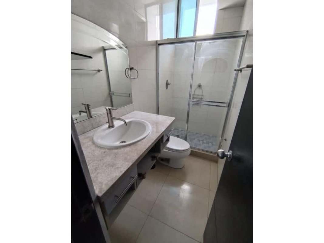 Bedroom featuring mirrored closet, AC, neutral tones PH Calle 77 Panama City