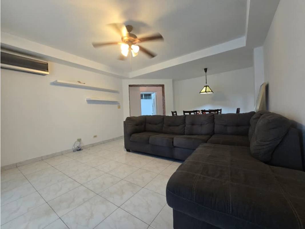 Living room with large sliding glass doors, balcony access, ceiling fan at Clayton Tower Clayton Panama