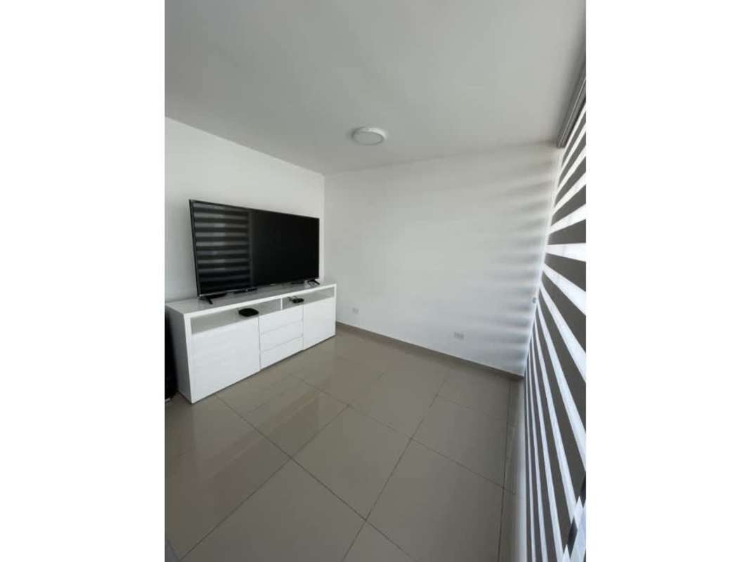 Modern bedroom with built-in wardrobe, split AC, and window at PH Sky Park Carrasquilla