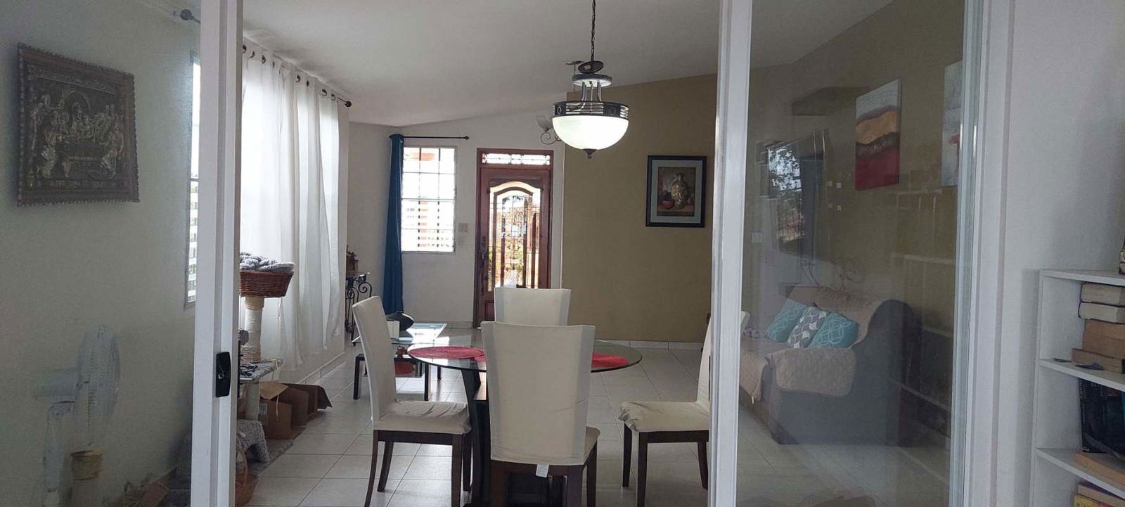 Bright kitchen with white cabinetry and appliances Brisas del Golf house for sale Panama