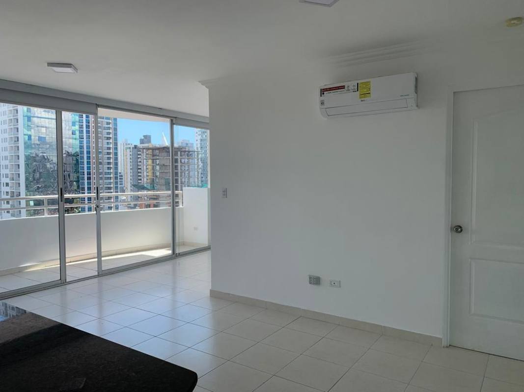 Living area with large windows city view balcony PH Montemar San Francisco Panama