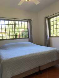 Spacious fenced garden with mature trees at Central Home El Valle de Antón Panama