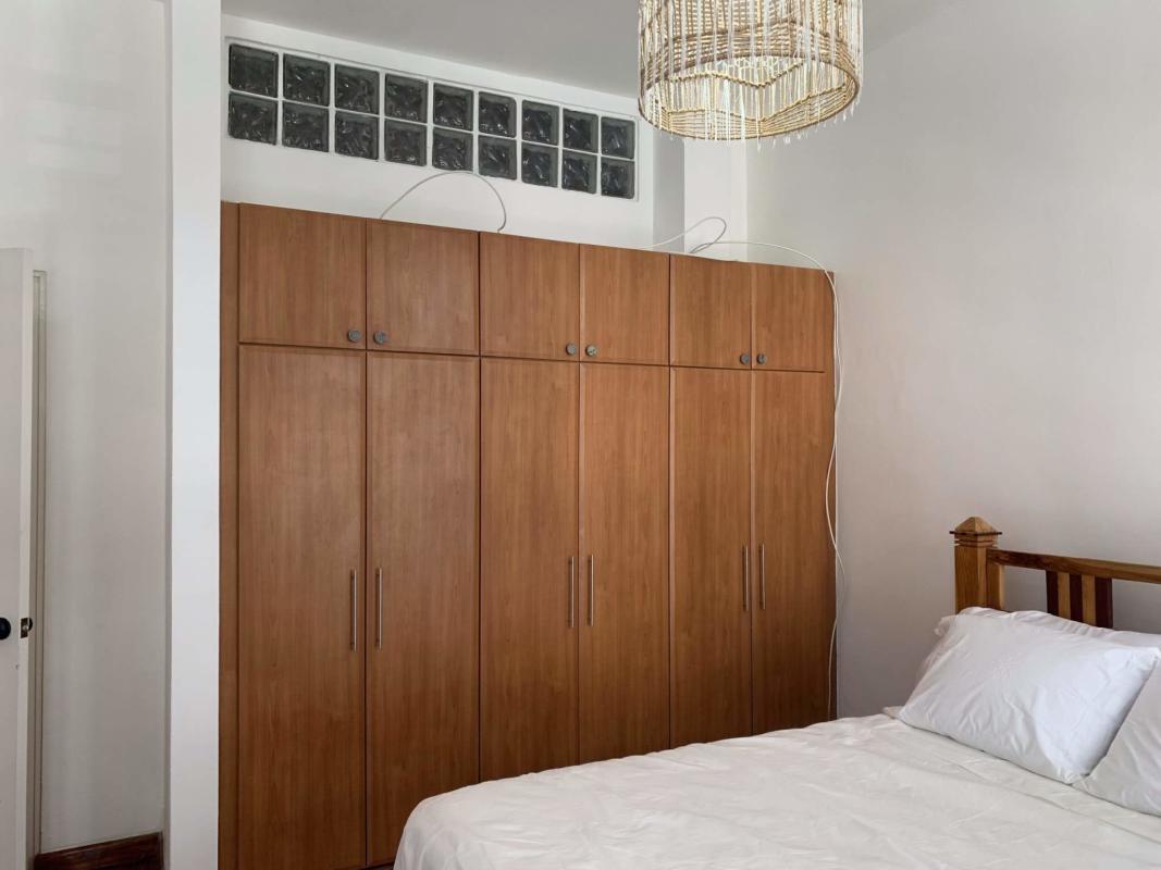 Large bedroom with built-in wardrobe bright window Star & Herald Residences Casco Panama