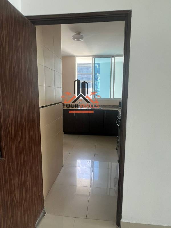 Modern kitchen with window ceramic countertop PH The Palm apartment for sale Panama City