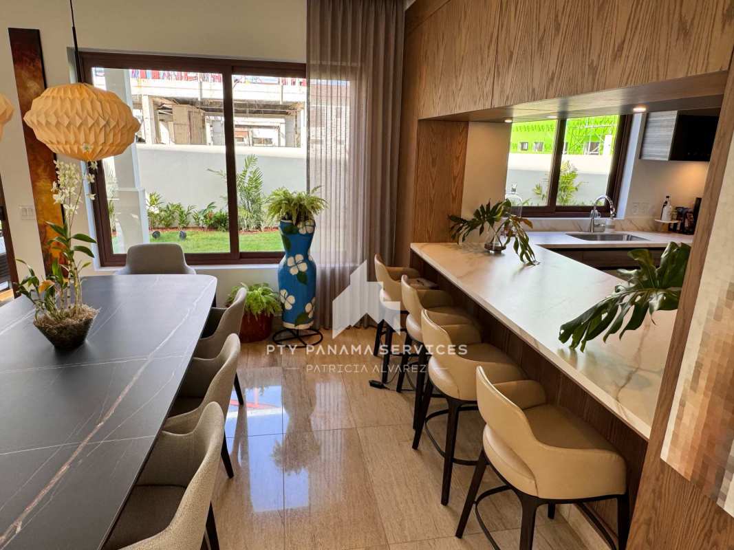 Master bedroom with large windows and marble floors in Santa Maria Golf house Panama City