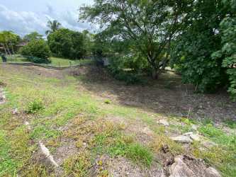 Functional bathroom with green sink toilet and shower Costa Esmeralda Panama beach property