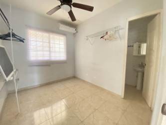 Bright bedroom with AC ceiling fan ensuite bath in Sajalices house Panama