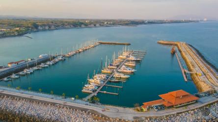 Aerial shot showing Vista Mar golf course, marina, residential towers and coastline