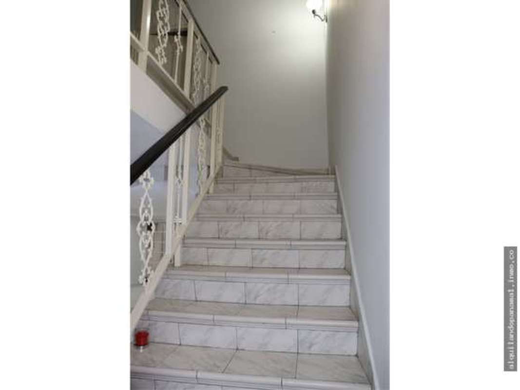 Hallway with staircase connecting two floors in commercial property Club X Panama City