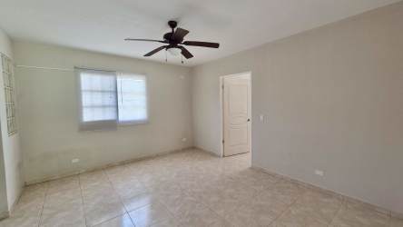 Remodeled community swimming pool and lush gardens in gated Sajalices residential Panama