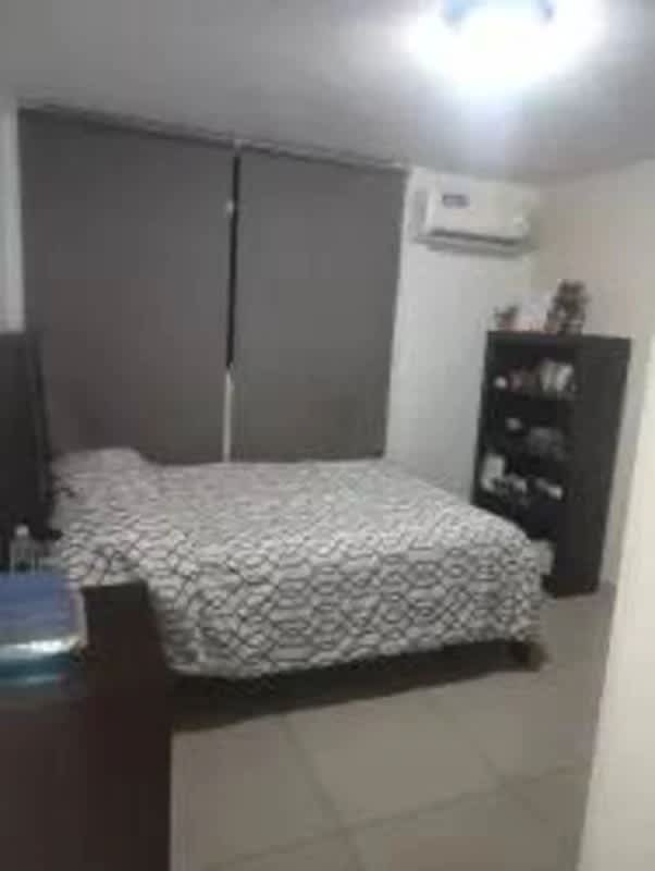 Compact kitchen with breakfast bar, refrigerator, stove in Coral Towers apartment Carrasquilla Panama City