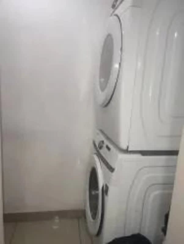 Rooftop swimming pool with wood deck overlooking Panama City skyline at PH Coral Towers