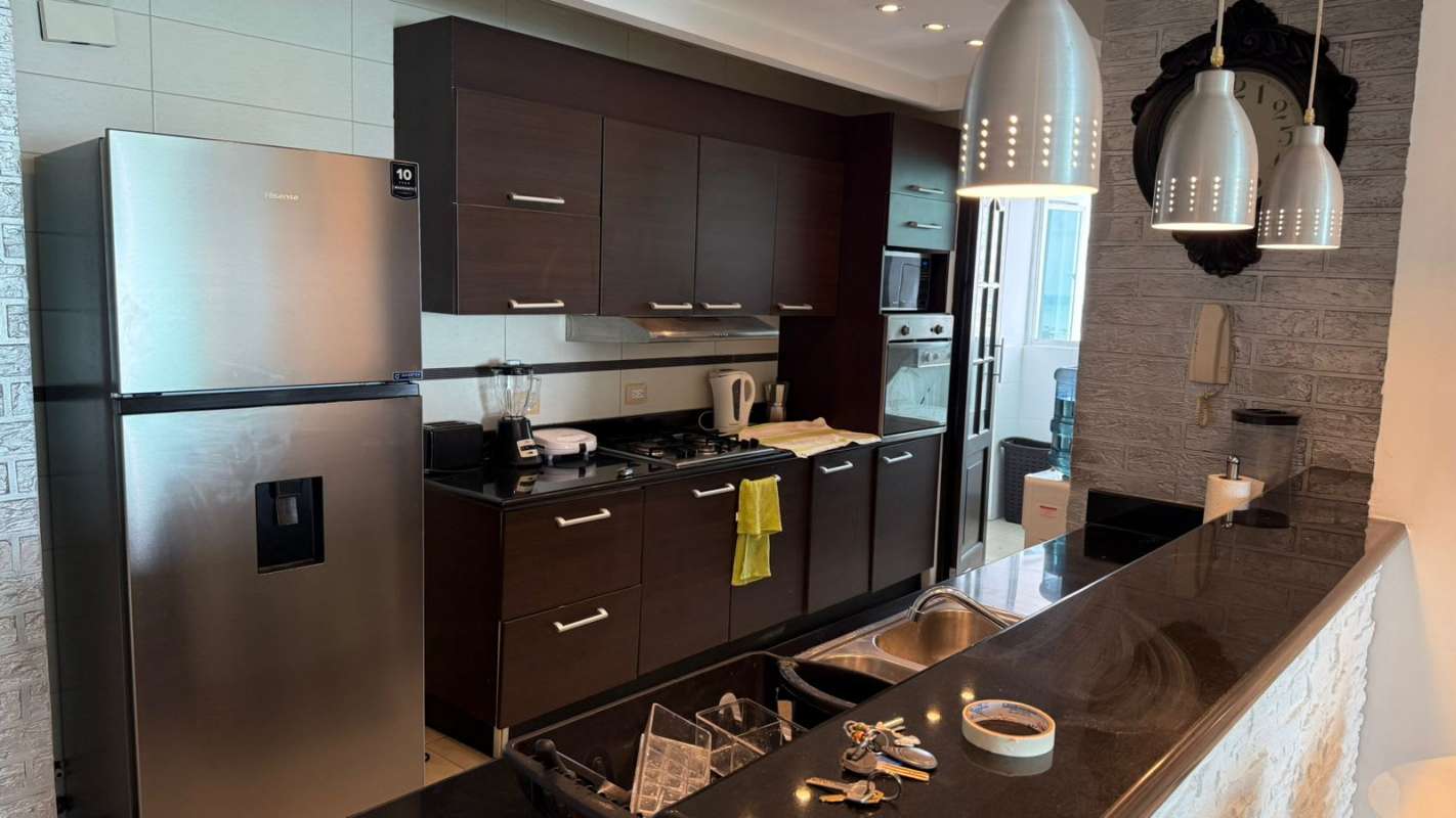 Modern bathroom with glass enclosed shower and vanity at PH Pacific Sea Panama City