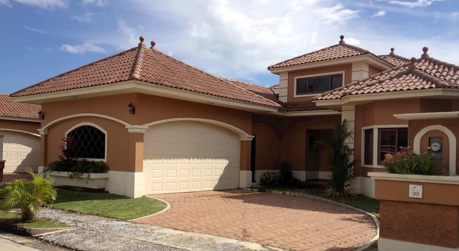 Elegant exterior with attached two-car garage Mediterranean house style Costa Sur Panama