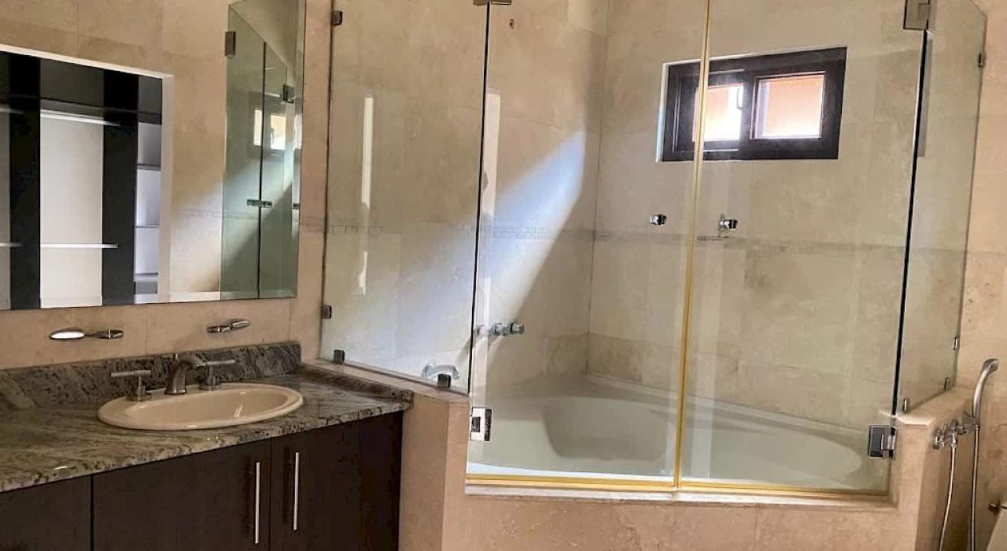 Covered patio with modern woven furniture overlooking lush garden Sunset Coast Costa Sur Panama