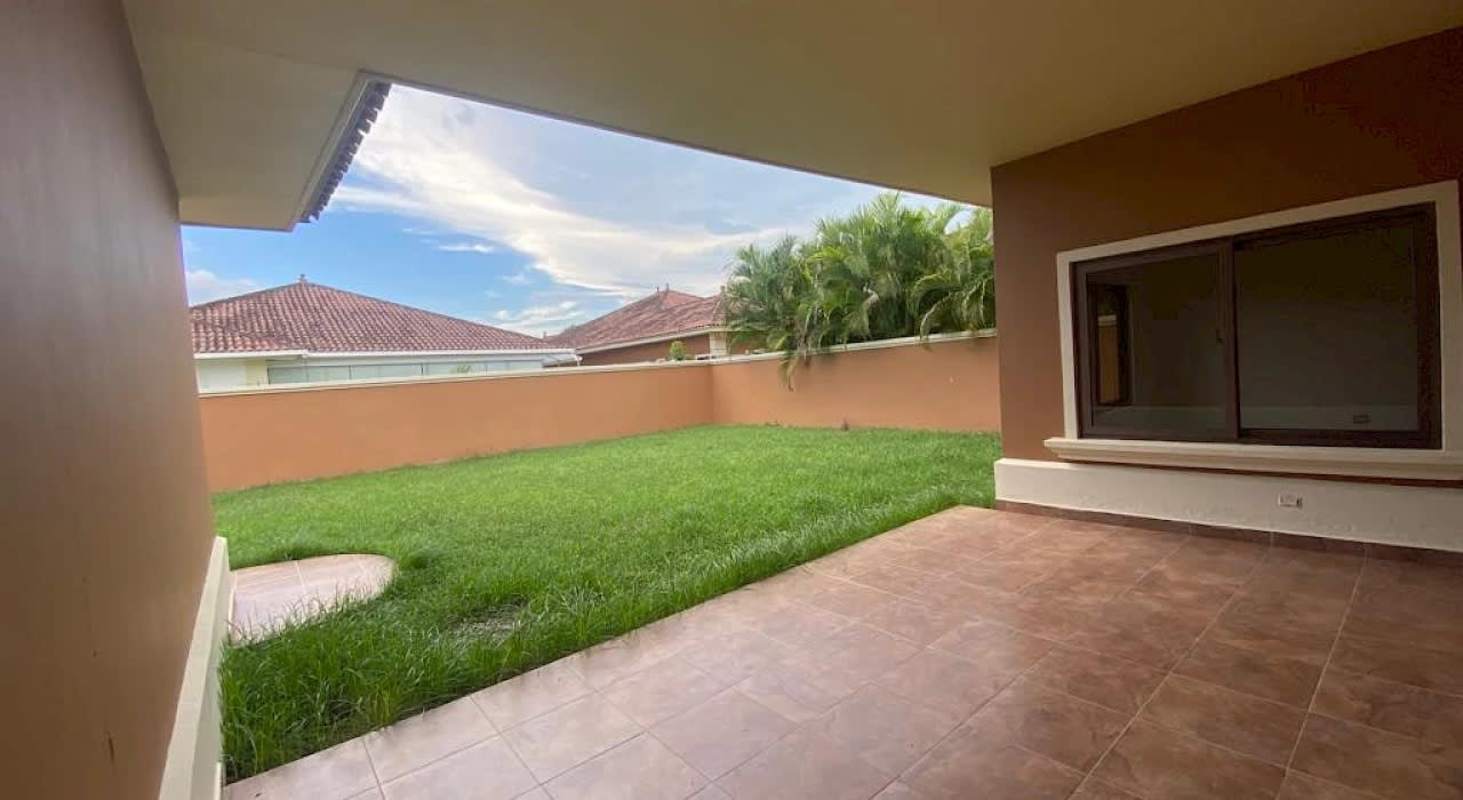 Fenced backyard garden and patio area lushly landscaped Costa Sur Sunset Coast Panama