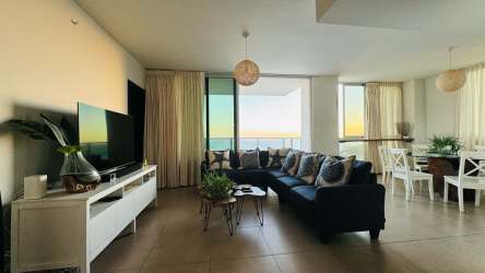 Multiple beachfront pools overlooking the ocean at Río Mar Residences San Carlos Panama