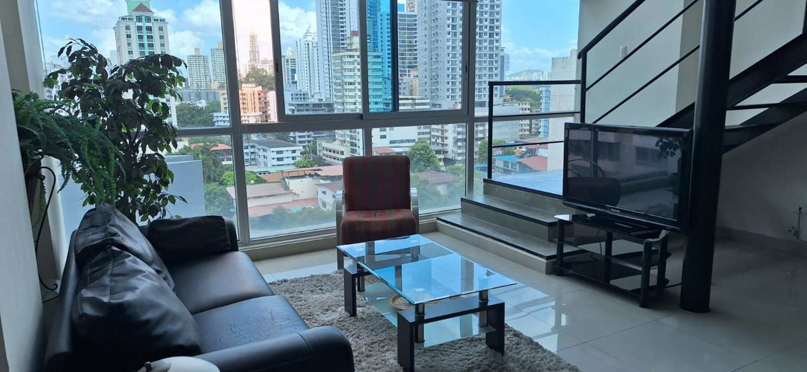 Open plan living dining area double-height windows PH Vitroloft El Cangrejo