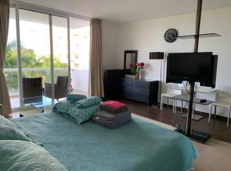 Bedroom with sliding doors accessing balcony lagoon view Playa Blanca