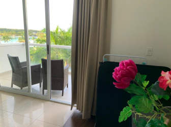 Living corner open to balcony with garden lagoon view Playa Blanca Panama