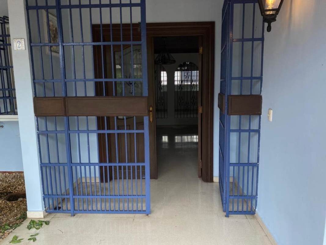 Laundry room with tile walls, utility sink, laundry space in residential house San Francisco Panama