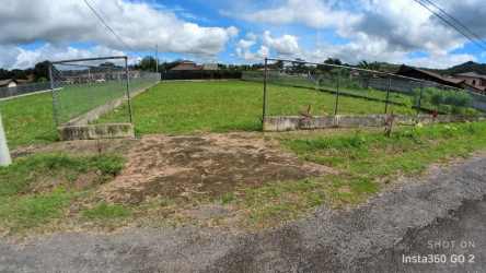 Flat open land with vehicle access gate fully fenced ready to build in Chigore Penonomé