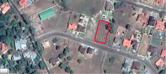 Aerial image of a fenced rectangular 950m2 land plot in quiet Penonomé neighborhood