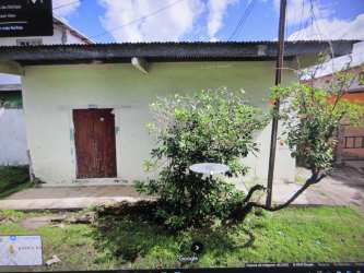 Front view of a one-story house with garden and security bars in David Chiriqui Panama