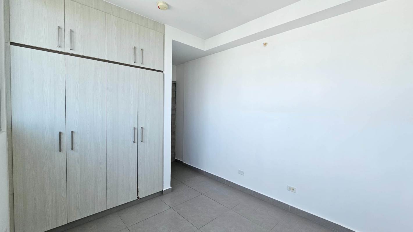 Bright open living room with ceramic floors, floor-to-ceiling windows city views in PH Signature Point Bella Vista Panama City