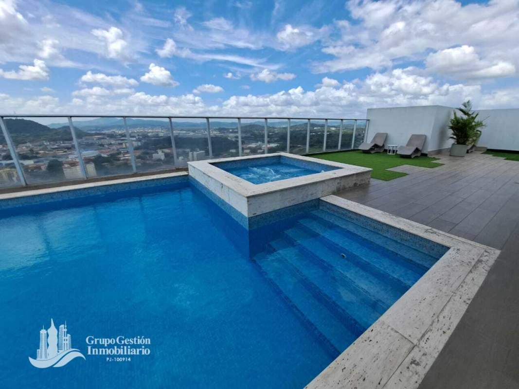 Contemporary gym with weight racks, machines, large mirrors PH Signature Point Panama