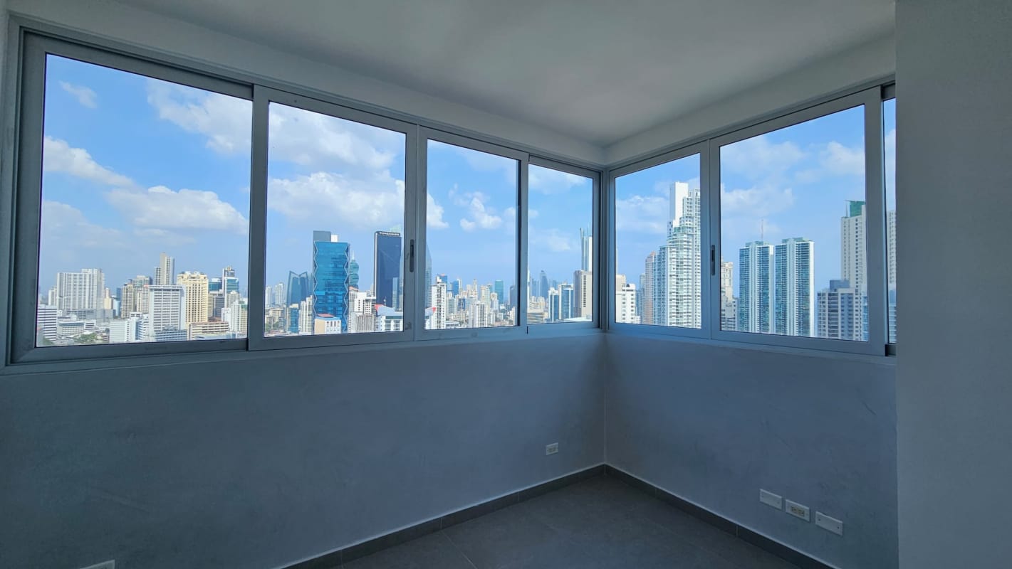 Bedroom with split AC and city skyline view PH Signature Point Bella Vista Panama