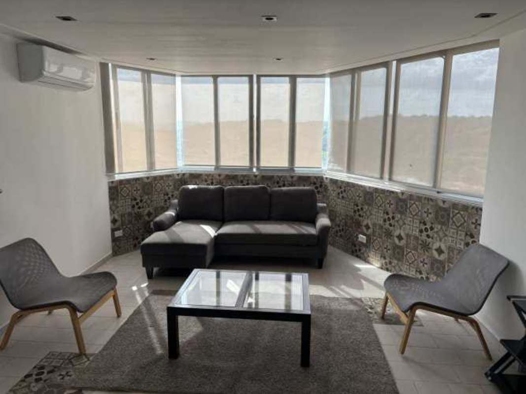 Urban apartment pool area with tiled deck and plants in Panama City