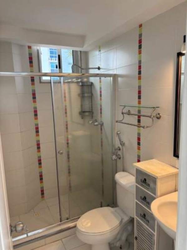 Contemporary bathroom with glass shower and colorful tile accents PH Villa de las Fuentes