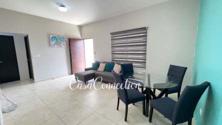 Minimalist bedroom with split AC, built-in closet, tile floor in furnished house Hacienda Real David