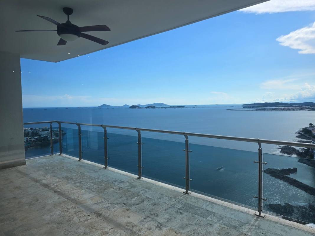 Spacious kitchen with granite countertops, large windows, wood cabinetry Punta Pacífica