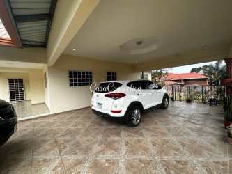 Spacious mountain house kitchen with wood cabinets and appliances in Volcán Chiriquí