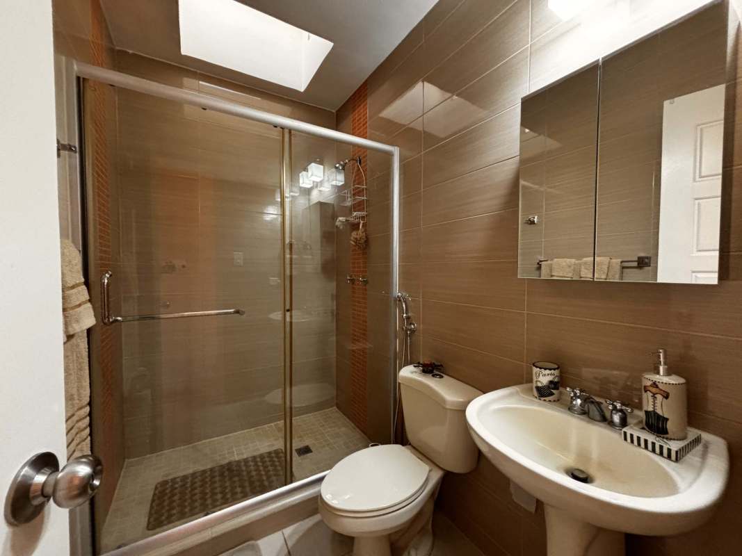 Large walk-in closet with storage shelving and drawers at Augusta Brisas del Golf Panama